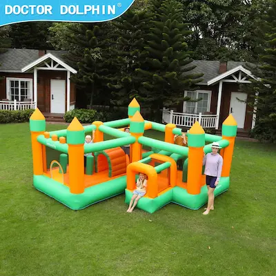 Adventure Kingdom inflatable obstacle course with dual castle sections set up on grass for party rental in Portland Oregon