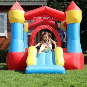 Toddler sliding down Cozy Castle bounce house rental in Beaverton Oregon backyard