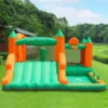 Grand Castle bounce house with wide slide and ball pit area rental set up on grass in Tualatin Oregon