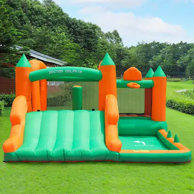 Grand Castle bounce house with wide slide and ball pit area rental set up on grass in Tualatin Oregon