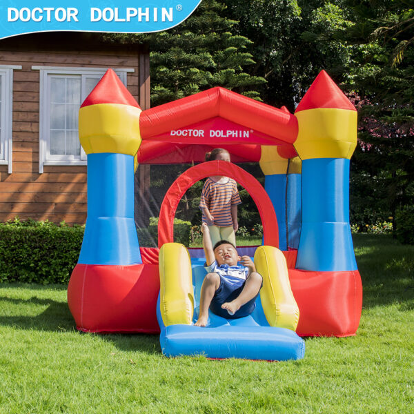 Boys playing and sliding on small castle bounce house rental perfect for toddlers in Beaverton Oregon