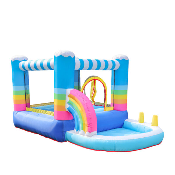 Rainbow themed bounce house with attached ball pit and cloud design available for rent in Beaverton OR