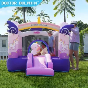 Pink and purple unicorn bounce house with slide set up in backyard for kids party rental in Hillsboro Oregon