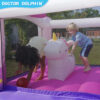 Kids riding inflatable unicorn toy inside pink unicorn bounce house rental in Hillsboro OR