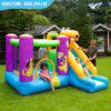 Children playing and sliding on puppy themed bounce house at backyard party in Tigard OR