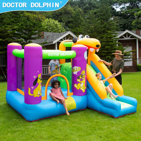 Children playing and sliding on puppy themed bounce house at backyard party in Tigard OR
