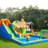 Carnival Splash Park with slide and large water pool set up on backyard grass - inflatable water park rental Portland Oregon