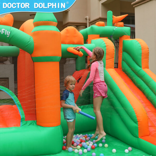 Kids playing basketball and bouncing in ball pit area of enchanted castle splash bouncer rental in Beaverton Oregon