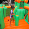 Child bouncing and playing inside spacious jump zone of Jungle Castle Splash Bouncer rental in Beaverton Oregon