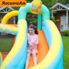 Girl sliding down the colorful slide on rock star bouncer combo rental in Beaverton Oregon