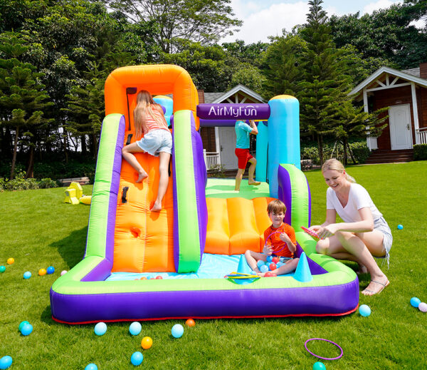 Kids climbing sliding and playing in ball pit on Summit Climber bounce house combo rental in Beaverton Oregon