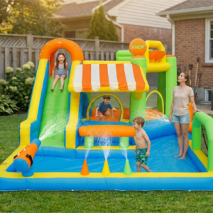 Kids playing on carnival themed splash park with slide water pool and shop awning in backyard - water slide rental Beaverton Oregon
