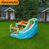 Rock star bouncer combo with slide and enclosed jump area set up on backyard grass - bounce house rental Beaverton
