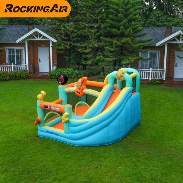 Rock star bouncer combo with slide and enclosed jump area set up on backyard grass - bounce house rental Beaverton